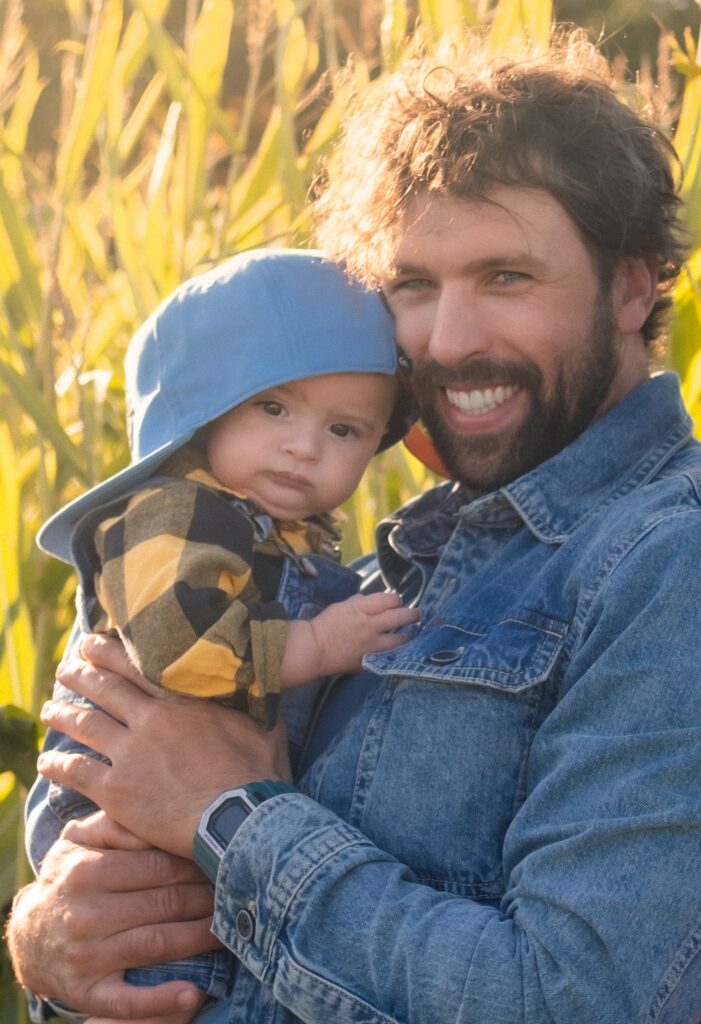Family 4 Photo of smiling dad hugging his young son among tall Jersey corn stalks