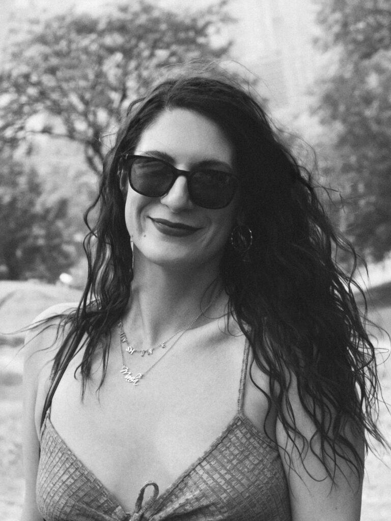 Girls portrait 3 Candid black‑and‑white portrait of a woman smiling in sunglasses.